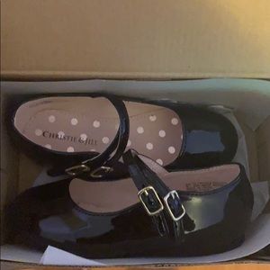 Girl’s black patent leather shoe